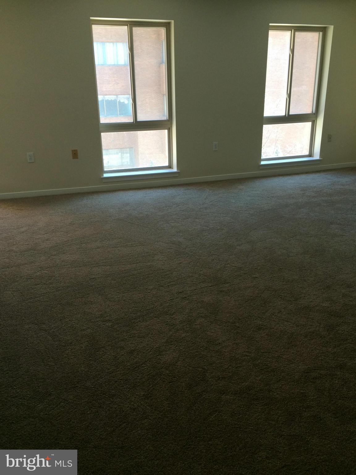 644 Charles Street, Unit R21 Baltimore, MD 21230 - Photo 2 of 7 an empty room with a window
