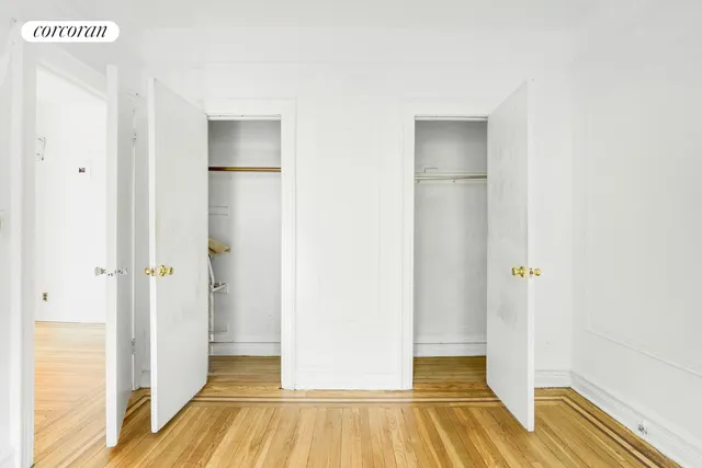 a view of a room with wooden floor and staircase