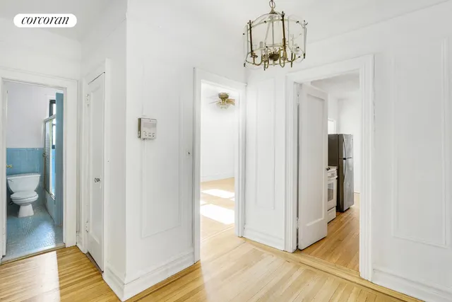 a view of a bathroom from a hallway