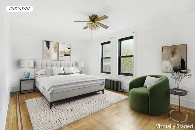 a bedroom with a bed couch and window