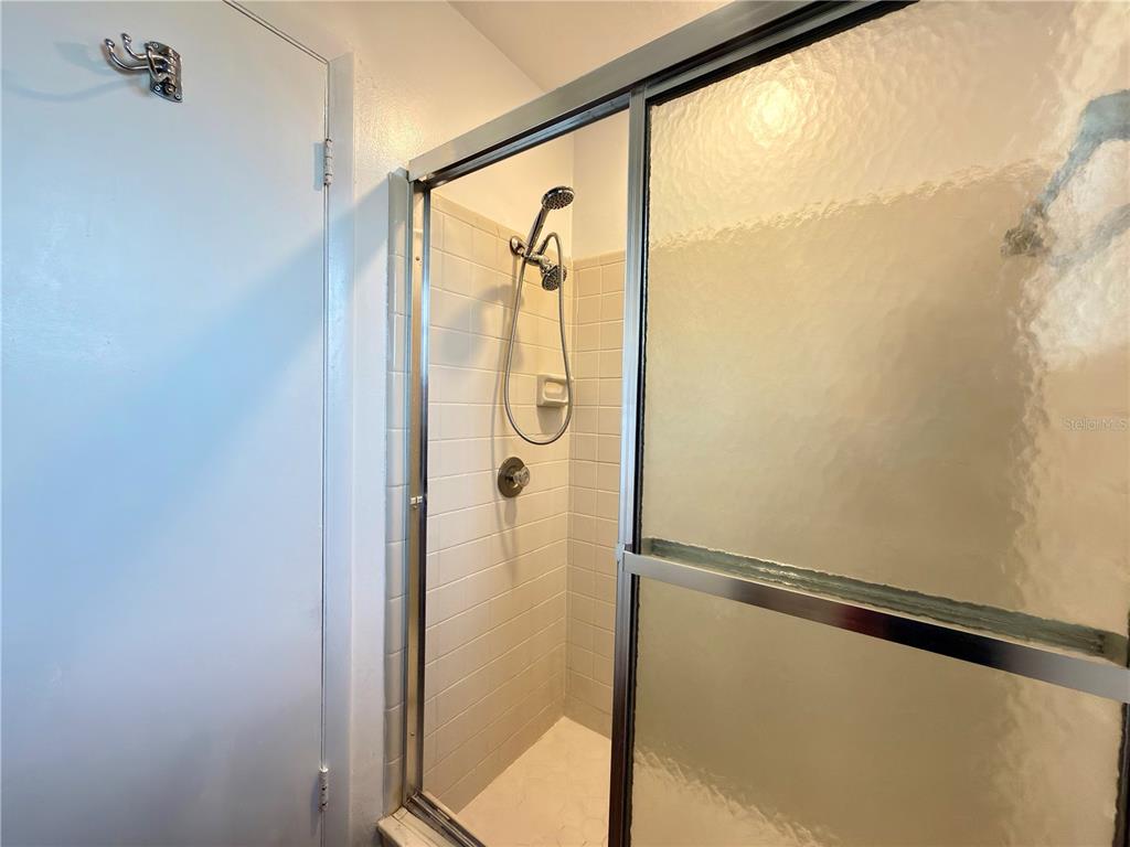 411 Parson Brown Way Longwood, FL 32750 - Photo 12 of 48 a bathroom with a shower and a sink