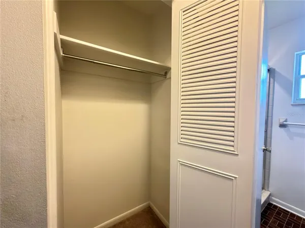 a bathroom with a white and white door