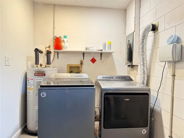 a utility room with washer and dryer