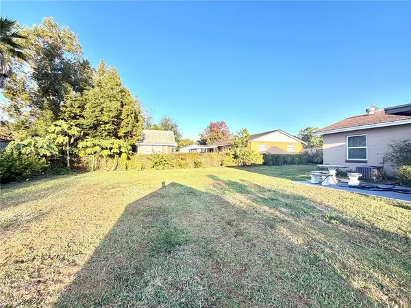 a view of a big yard with a house