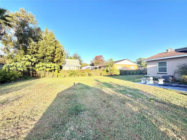 a view of a swimming pool with a yard