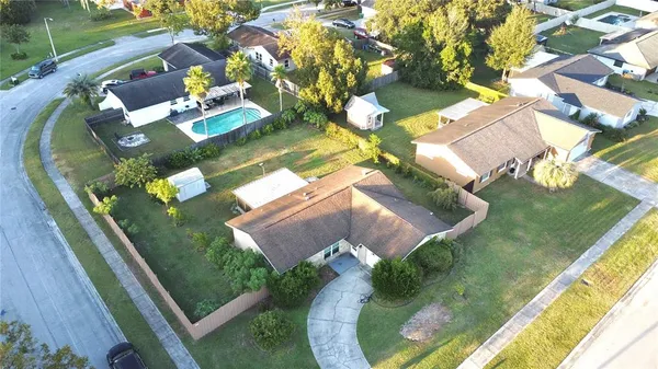 an aerial view of residential houses with outdoor space