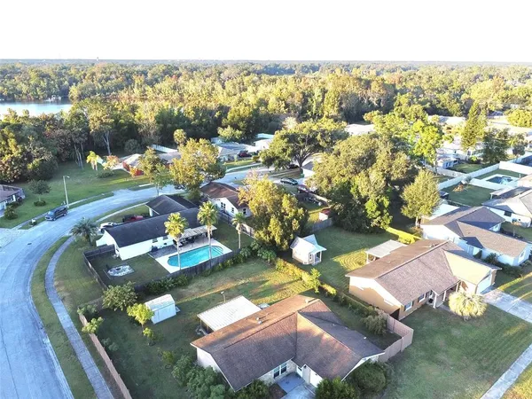 an aerial view of a house with a yard