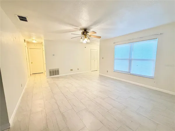 a view of an empty room with a window