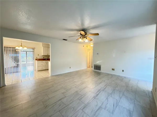a view of a livingroom with wooden floor