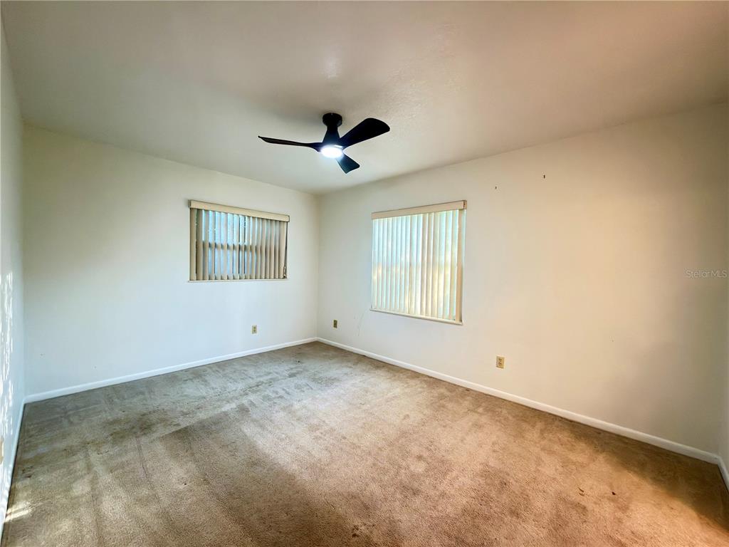 411 Parson Brown Way Longwood, FL 32750 - Photo 7 of 48 a view of an empty room with a window