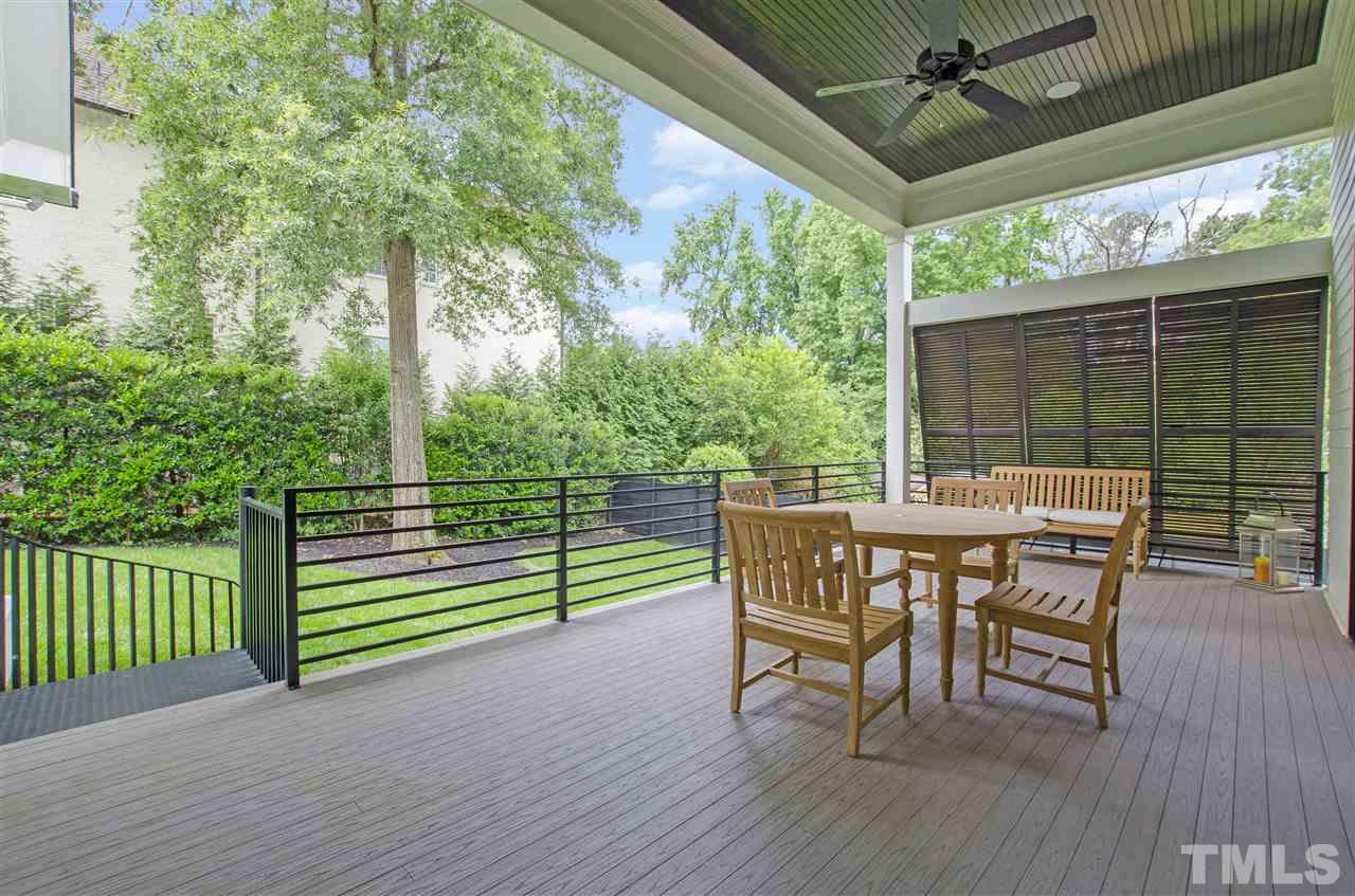 2325 Hathaway Road Raleigh, NC 27608 - Photo 14 of 25 a view of a deck with a table and chairs