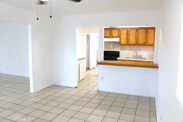 a view of kitchen with furniture and window