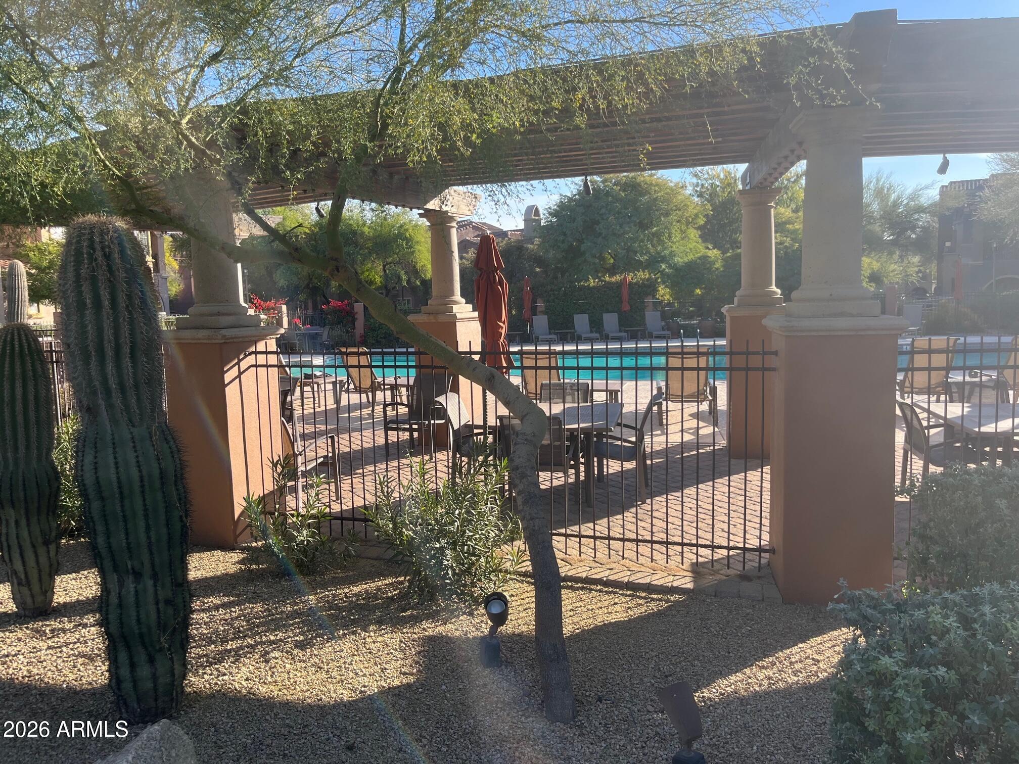 3935 East Rough Rider Road, Unit 1057 Phoenix, AZ 85050 - Photo 19 of 21 a view of balcony with a porch