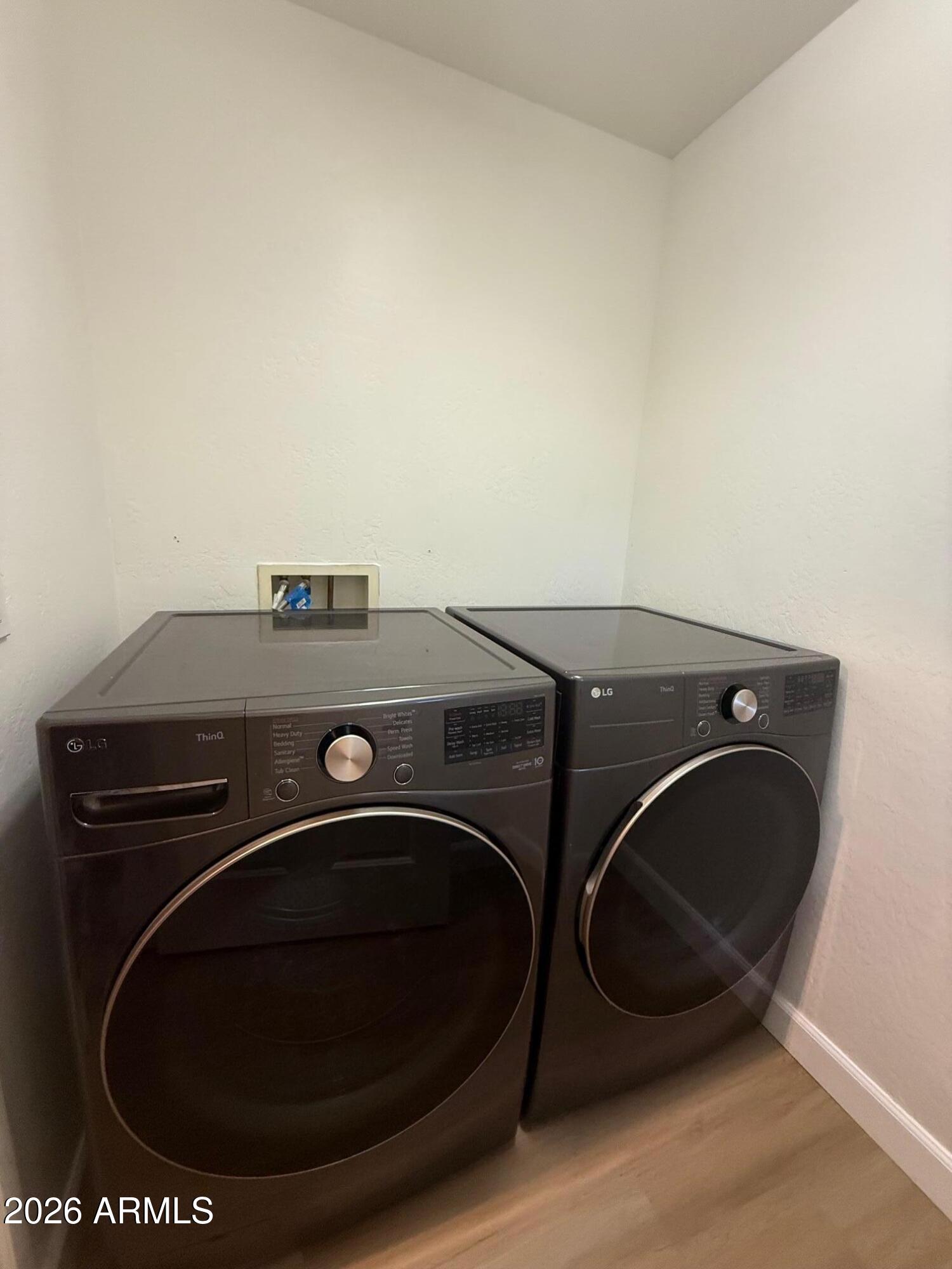 3935 East Rough Rider Road, Unit 1057 Phoenix, AZ 85050 - Photo 5 of 21 a utility room with dryer and washer