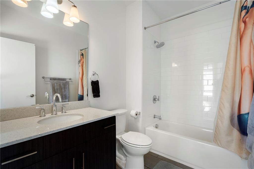 61 Moda Lane Atlanta, GA 30307 - Photo 19 of 34 a bathroom with a sink a toilet and shower