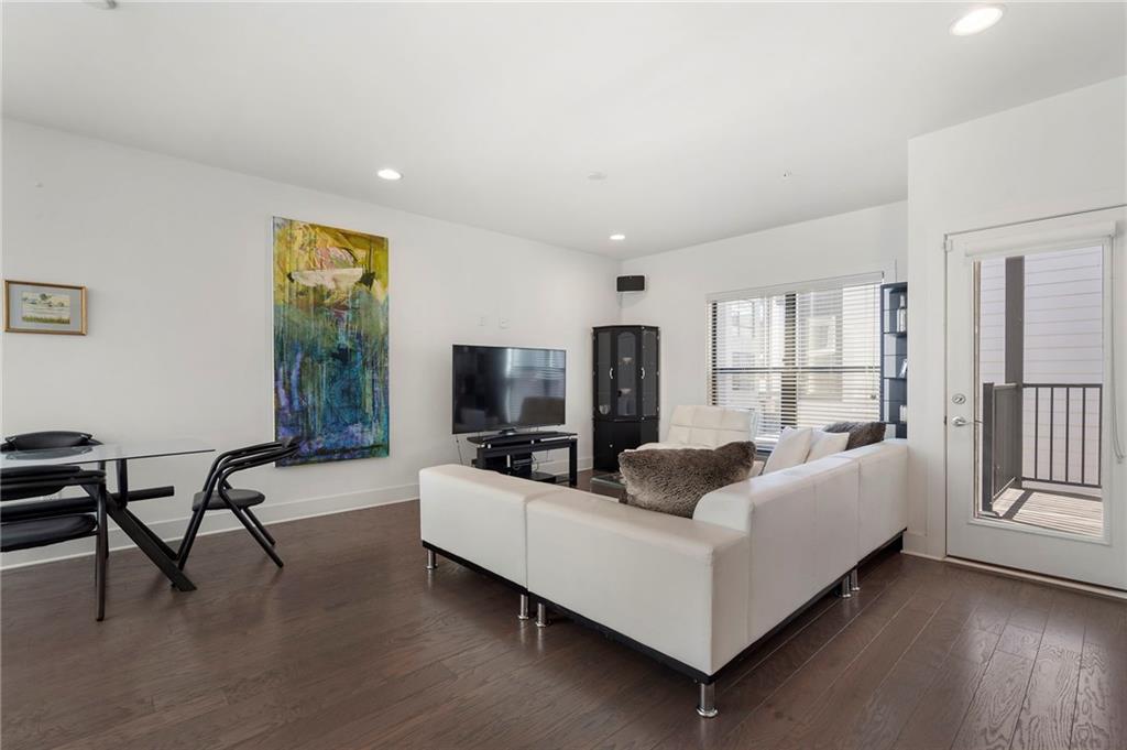 61 Moda Lane Atlanta, GA 30307 - Photo 2 of 34 a living room with furniture and a flat screen tv