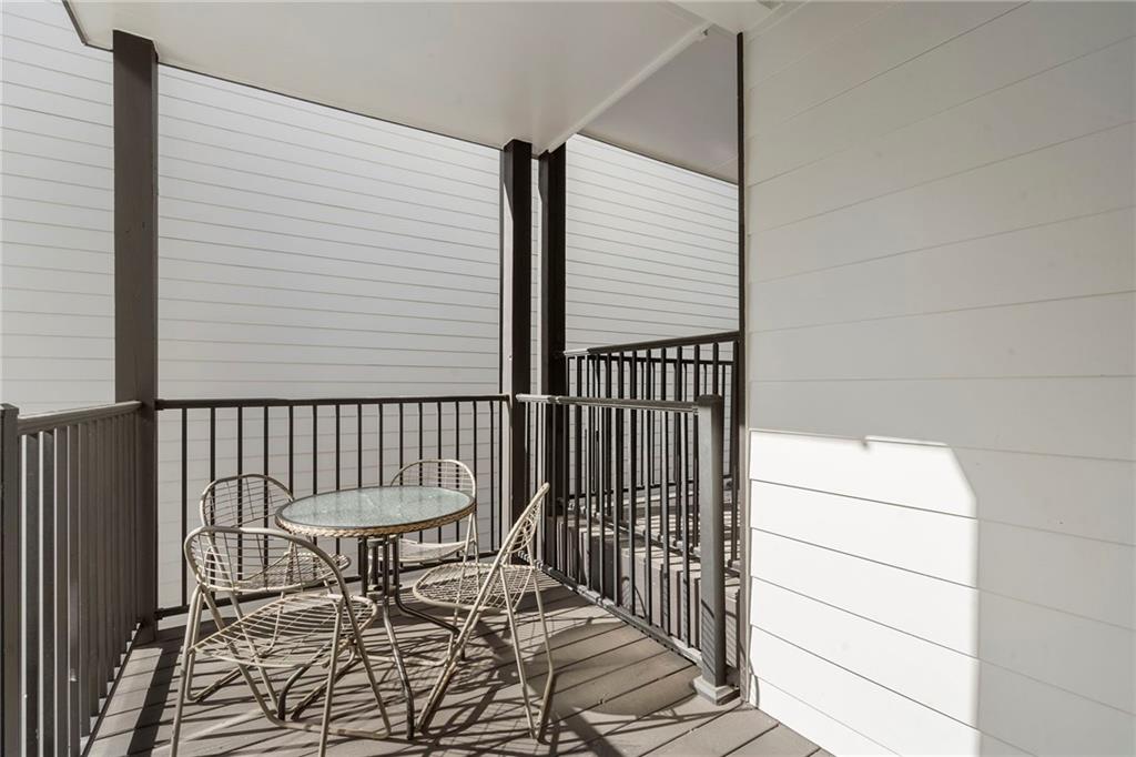61 Moda Lane Atlanta, GA 30307 - Photo 24 of 34 a porch with a bench and a bench