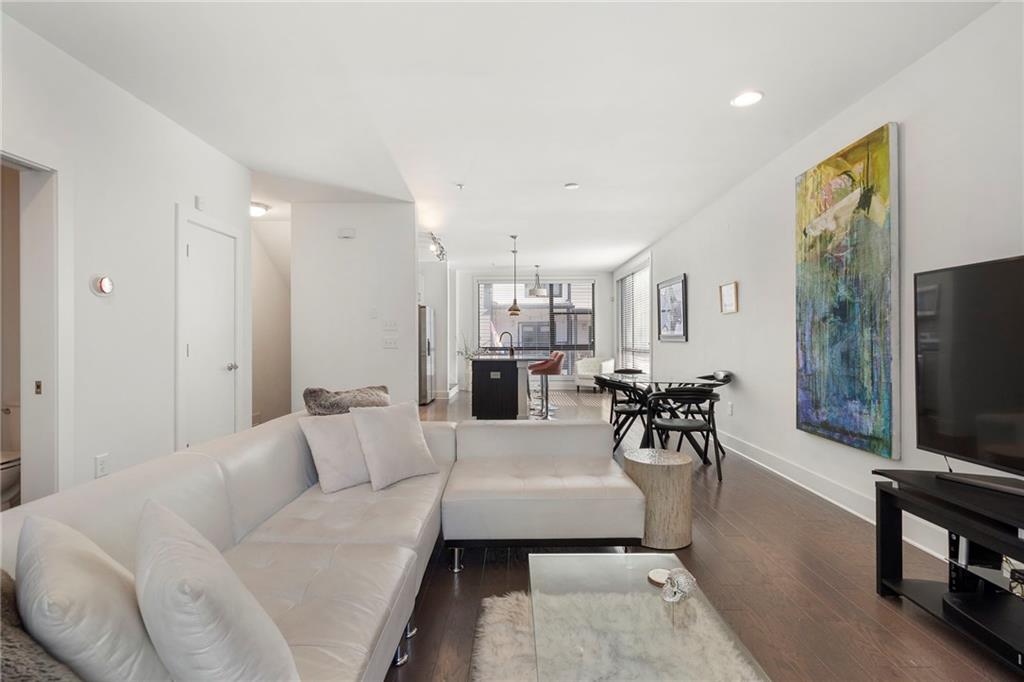 61 Moda Lane Atlanta, GA 30307 - Photo 3 of 34 a living room with furniture and a flat screen tv