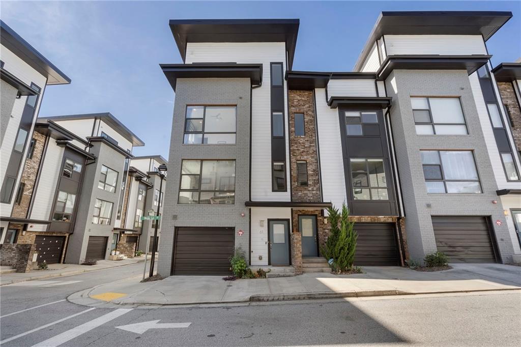 61 Moda Lane Atlanta, GA 30307 - Photo 34 of 34 a front view of a residential apartment building with a yard