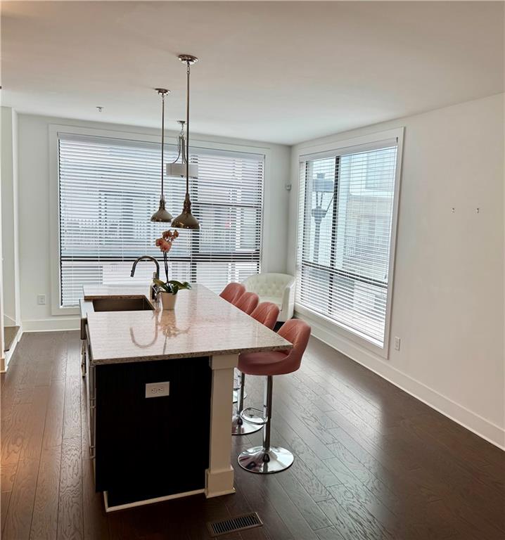 61 Moda Lane Atlanta, GA 30307 - Photo 5 of 34 a kitchen with a sink a window and wooden floor