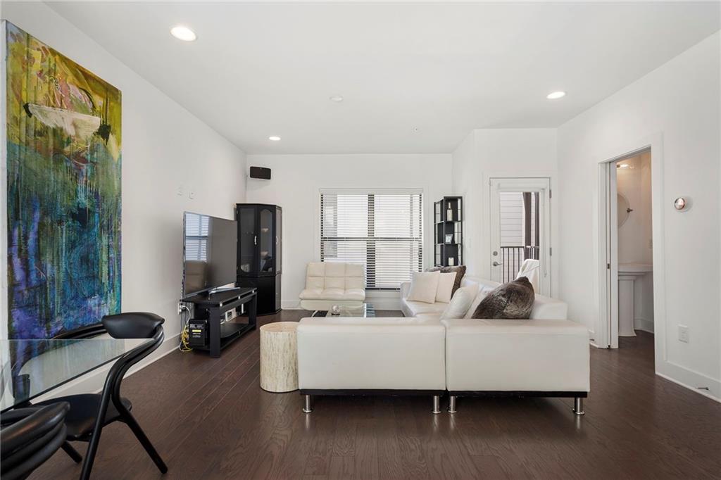 61 Moda Lane Atlanta, GA 30307 - Photo 8 of 34 a living room with furniture and a flat screen tv