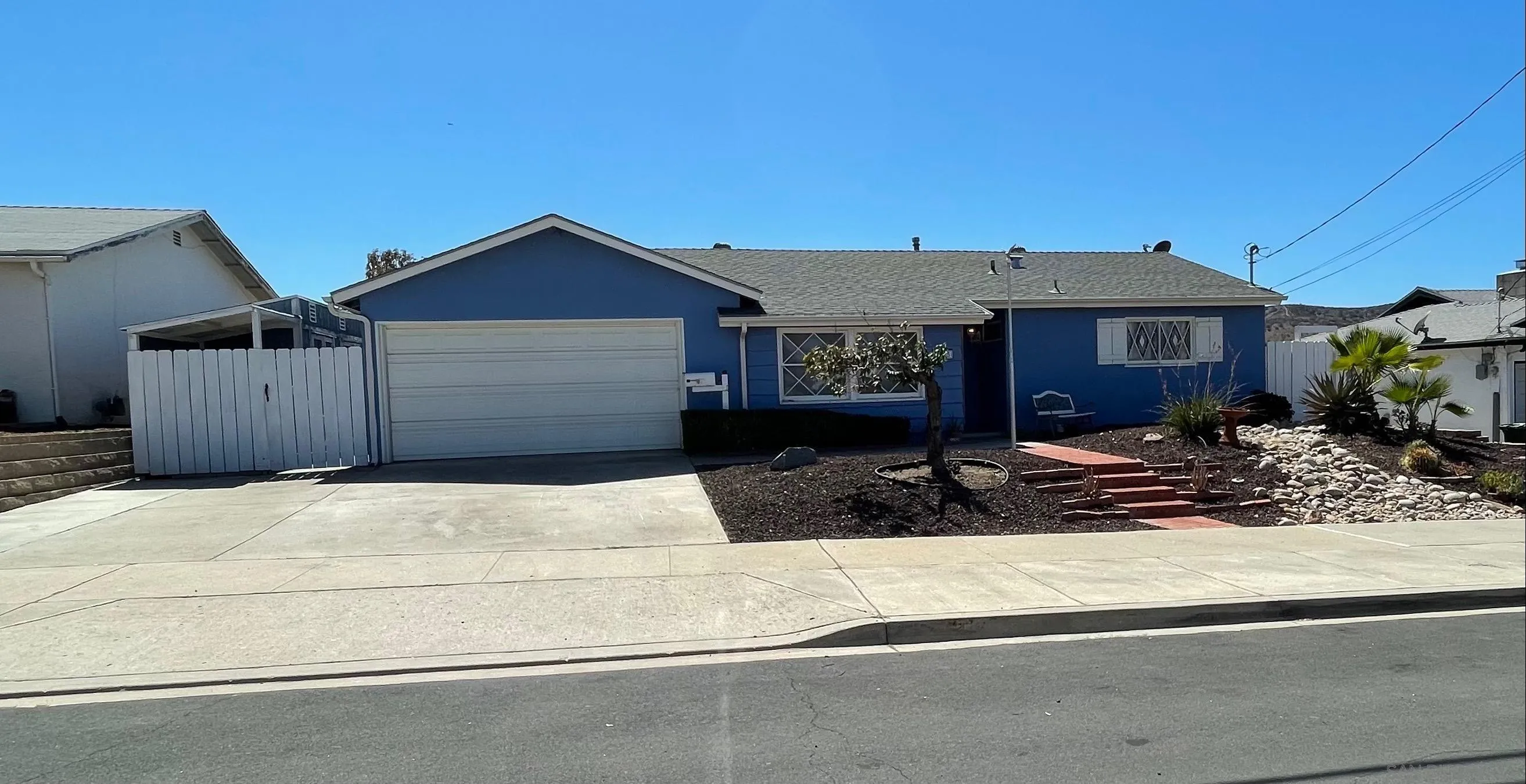 9225 Penmar Road Santee, CA 92071 - Photo 1 of 17 a front view of a house with a yard