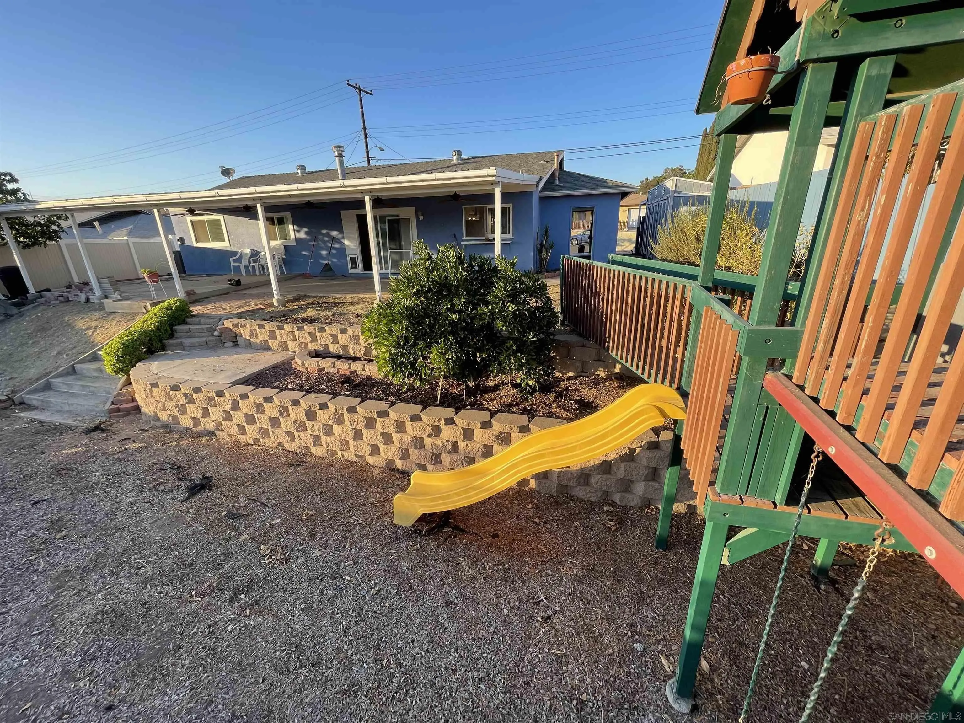 9225 Penmar Road Santee, CA 92071 - Photo 16 of 17 a view of a house with backyard and porch