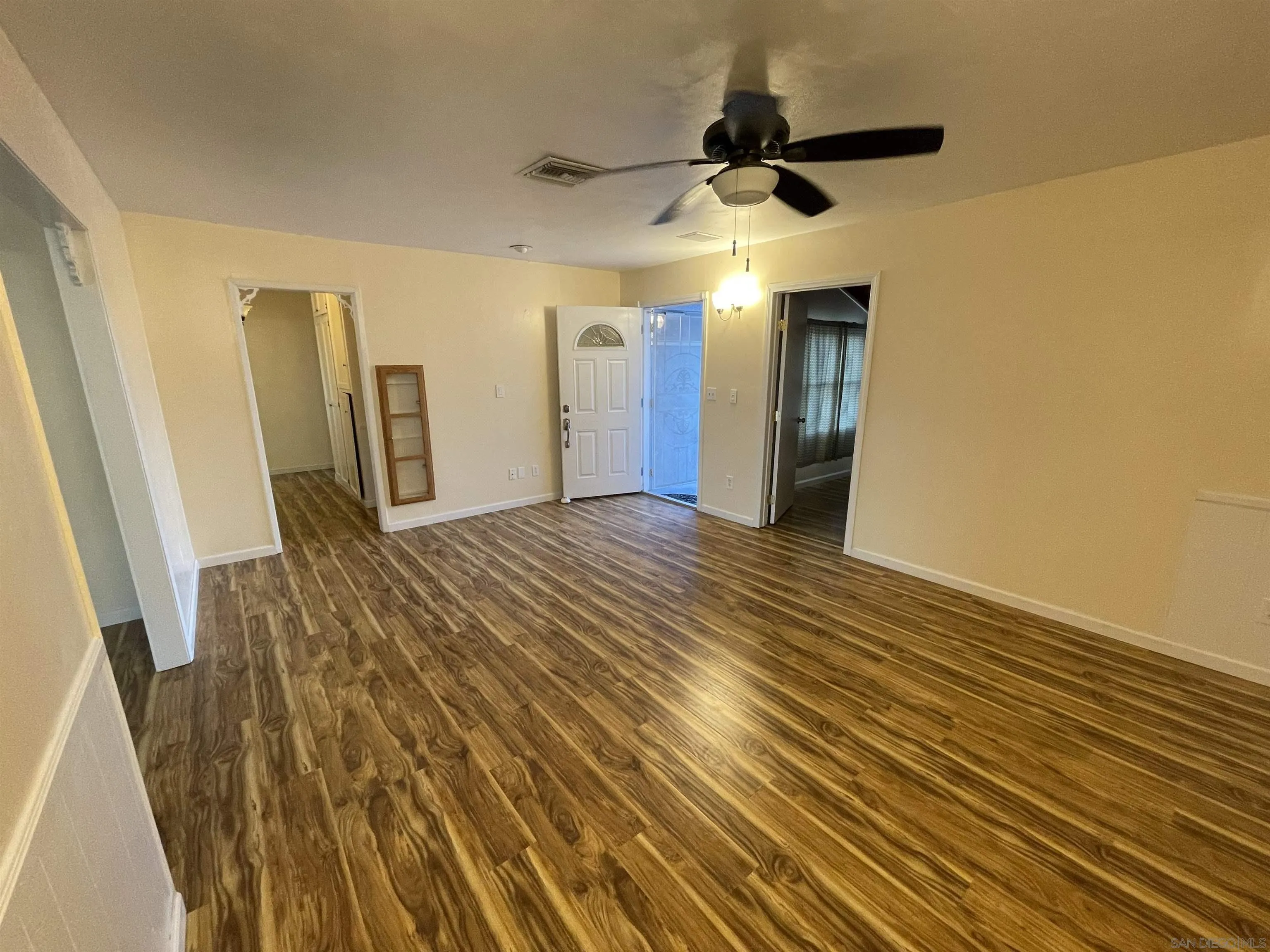 9225 Penmar Road Santee, CA 92071 - Photo 2 of 17 wooden floor in an empty room with a window
