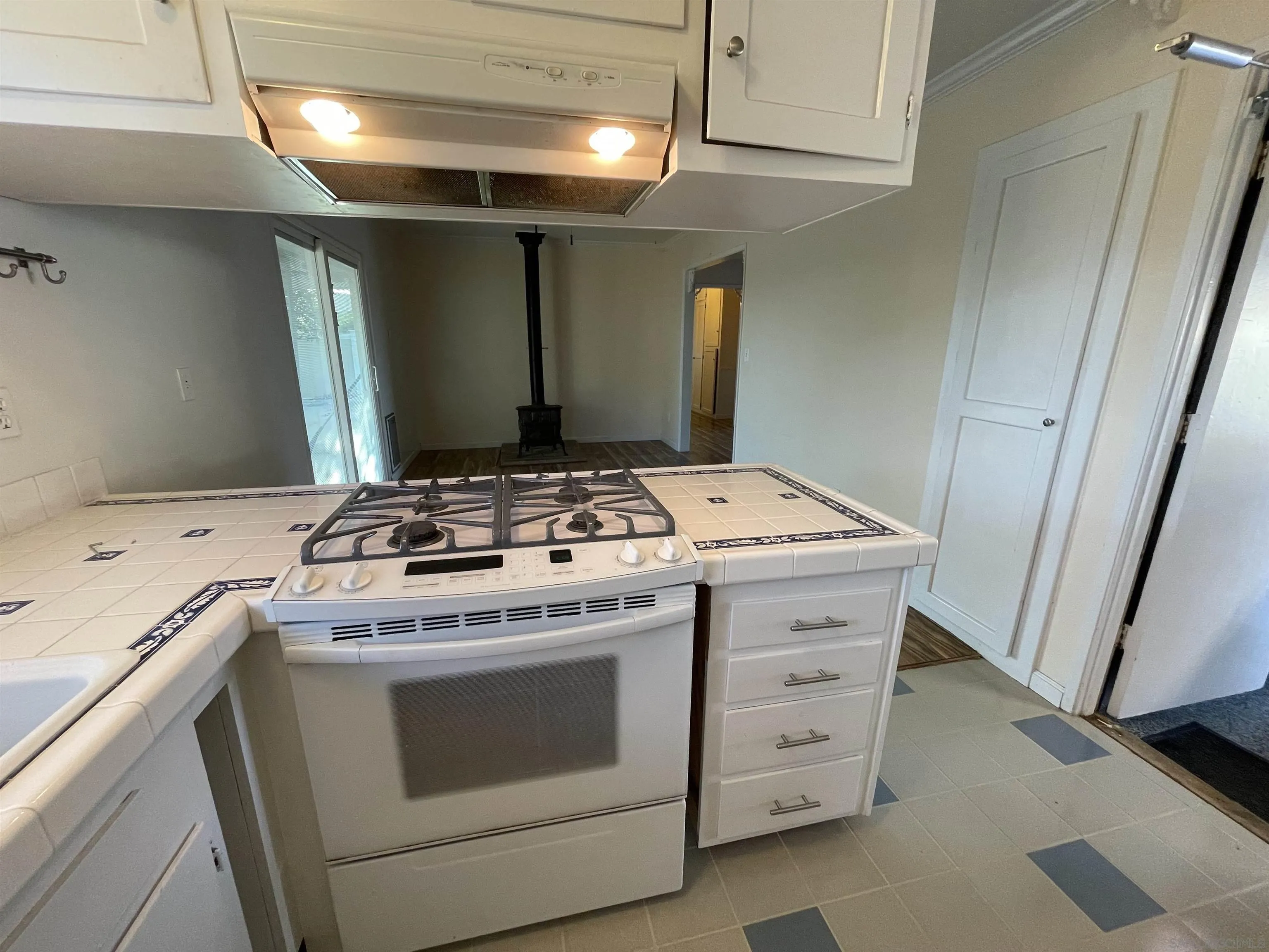9225 Penmar Road Santee, CA 92071 - Photo 6 of 17 a kitchen with a stove and a refrigerator