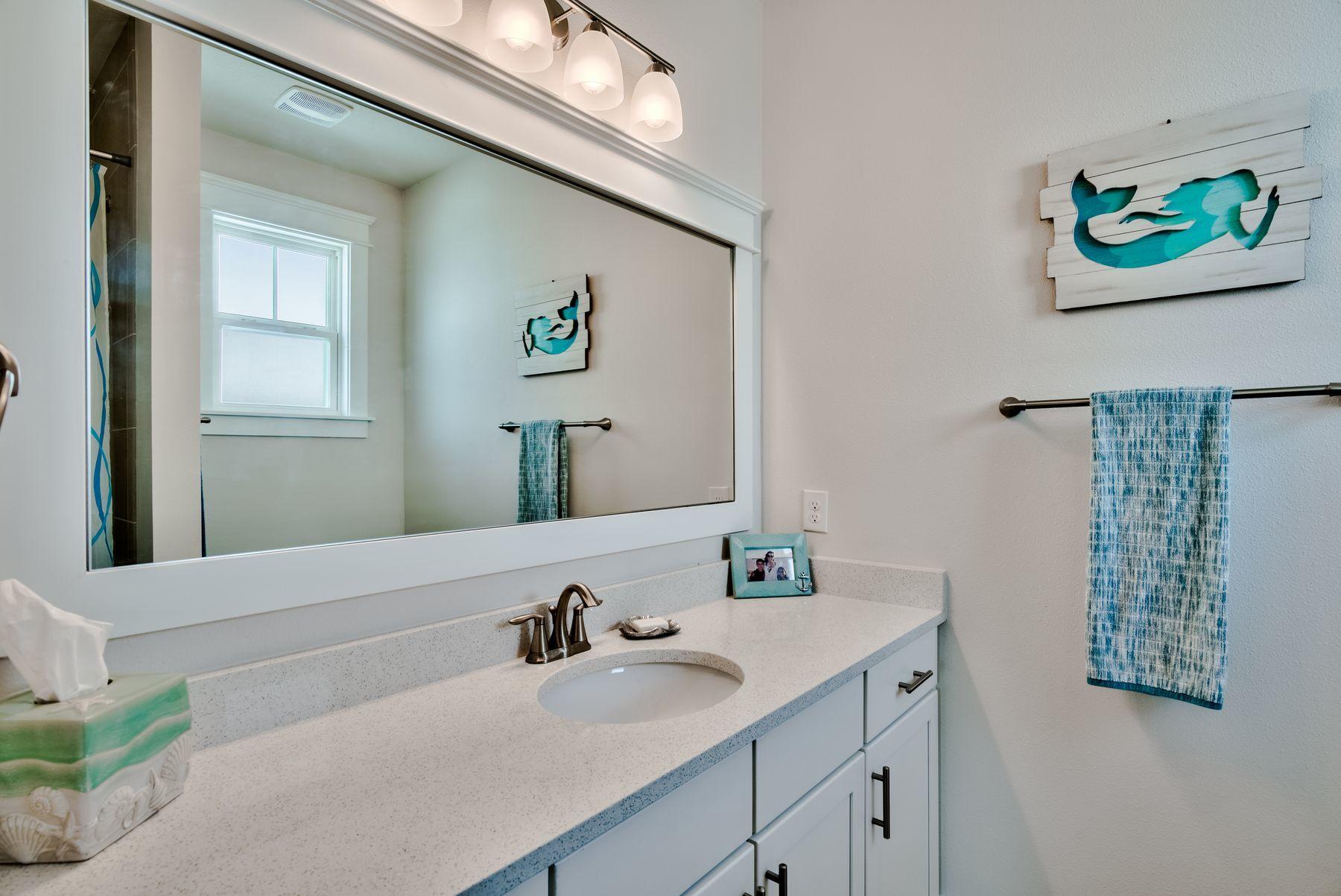 125 Grande Pointe Circle Inlet Beach, FL 32461 - Photo 27 of 30 a bathroom with a sink mirror and vanity