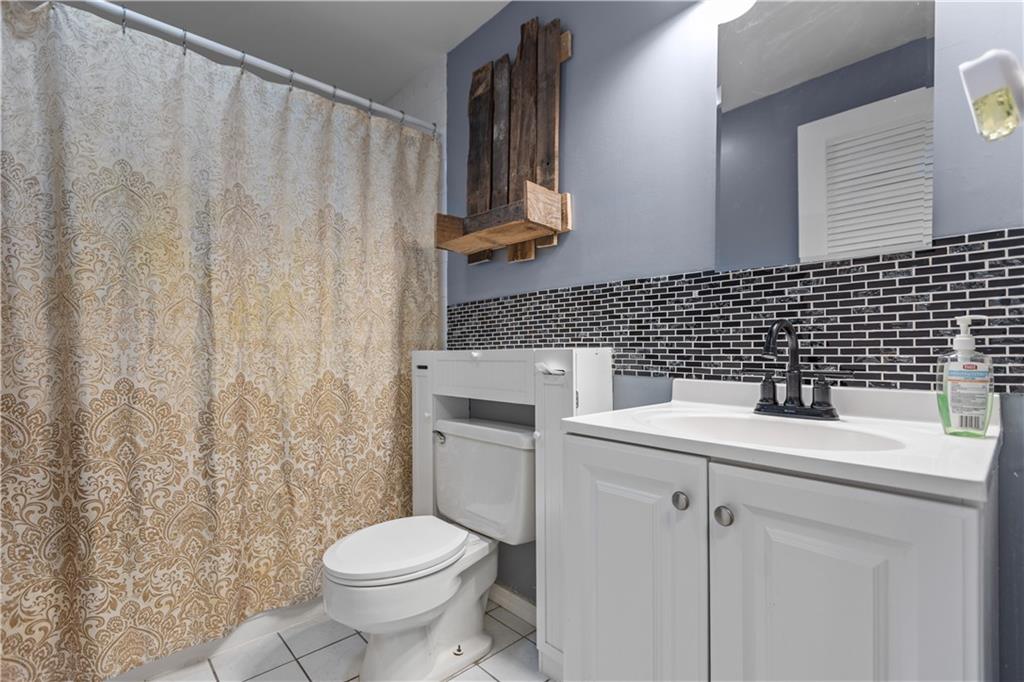 706 Countryside Drive McKees Rocks, PA 15136 - Photo 16 of 23 a bathroom with a sink toilet and shower