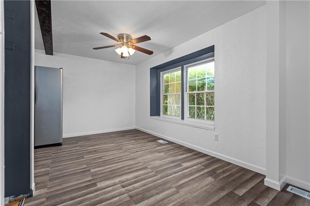 706 Countryside Drive McKees Rocks, PA 15136 - Photo 7 of 23 a view of an empty room with wooden floor and a window