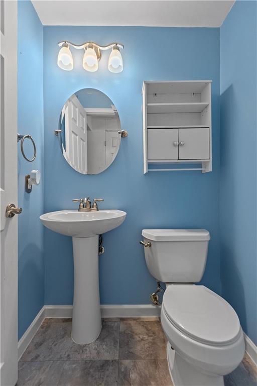 706 Countryside Drive McKees Rocks, PA 15136 - Photo 8 of 23 a bathroom with a toilet sink and mirror