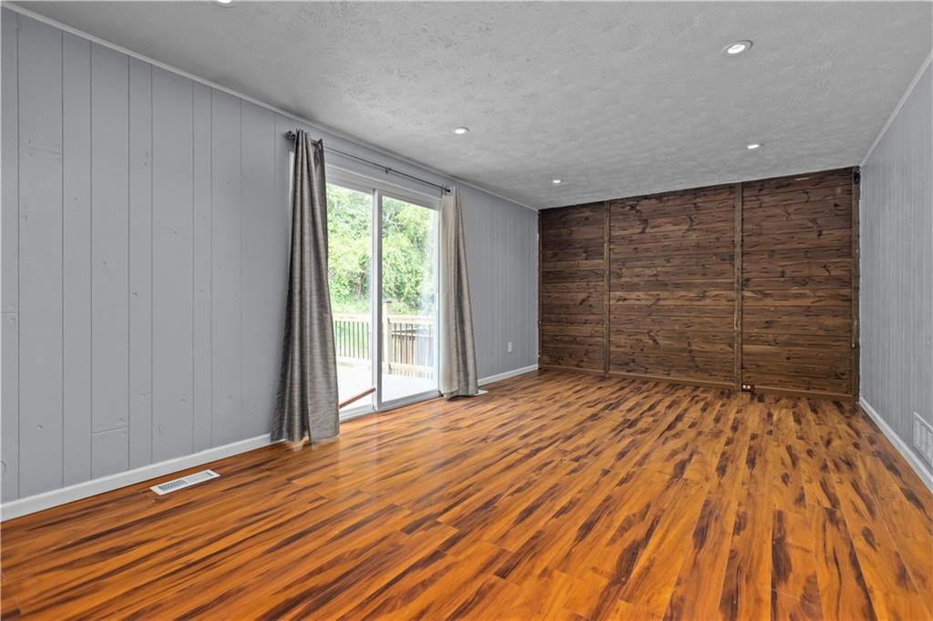706 Countryside Drive McKees Rocks, PA 15136 - Photo 9 of 23 a view of empty room with wooden floor and fan