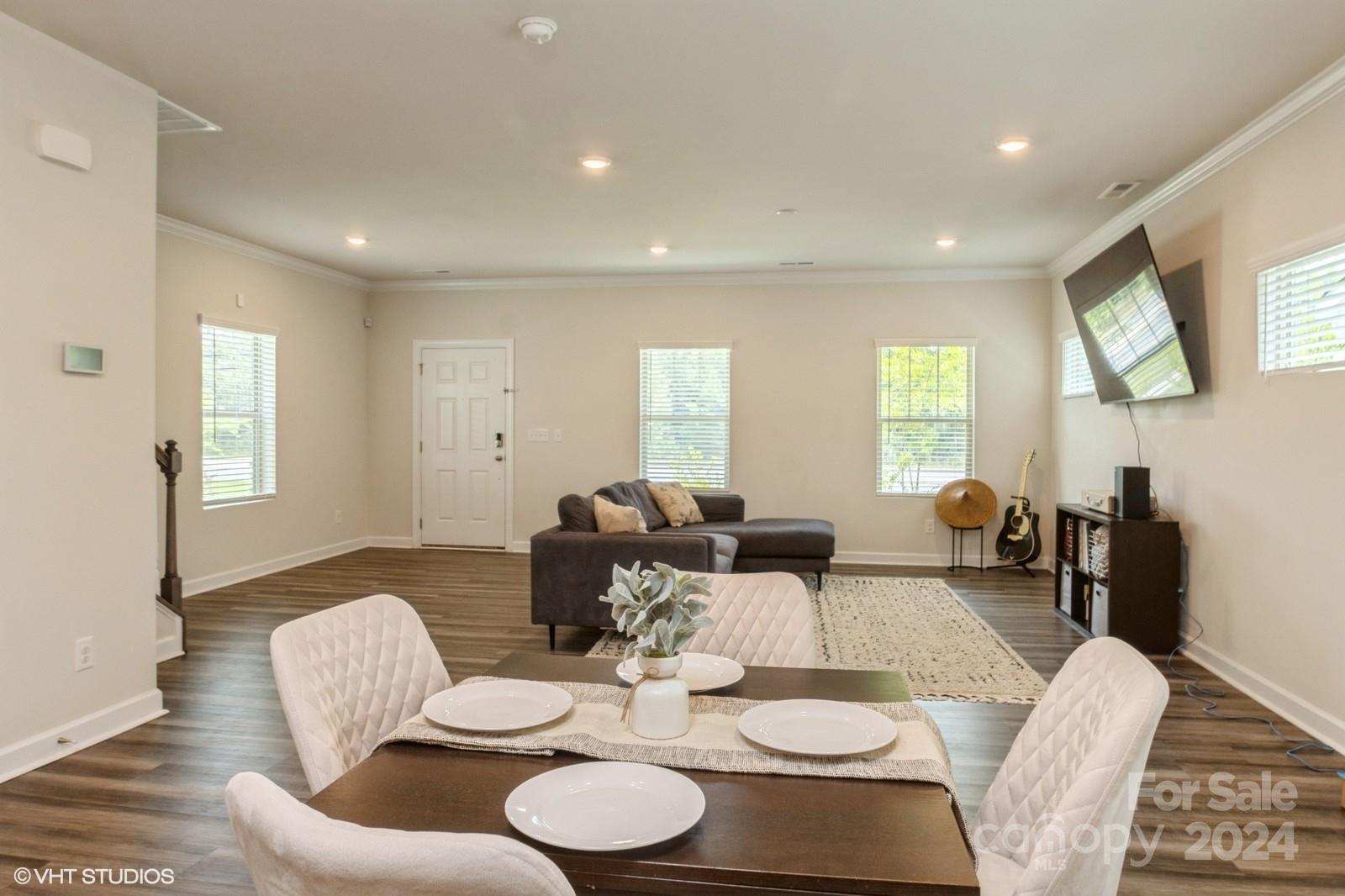 11955 Old Statesville Road Huntersville, NC 28078 - Photo 13 of 39 a dining room with furniture a window and wooden floor