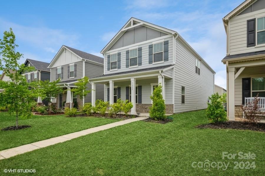 11955 Old Statesville Road Huntersville, NC 28078 - Photo 2 of 39 a front view of a house with a yard and trees