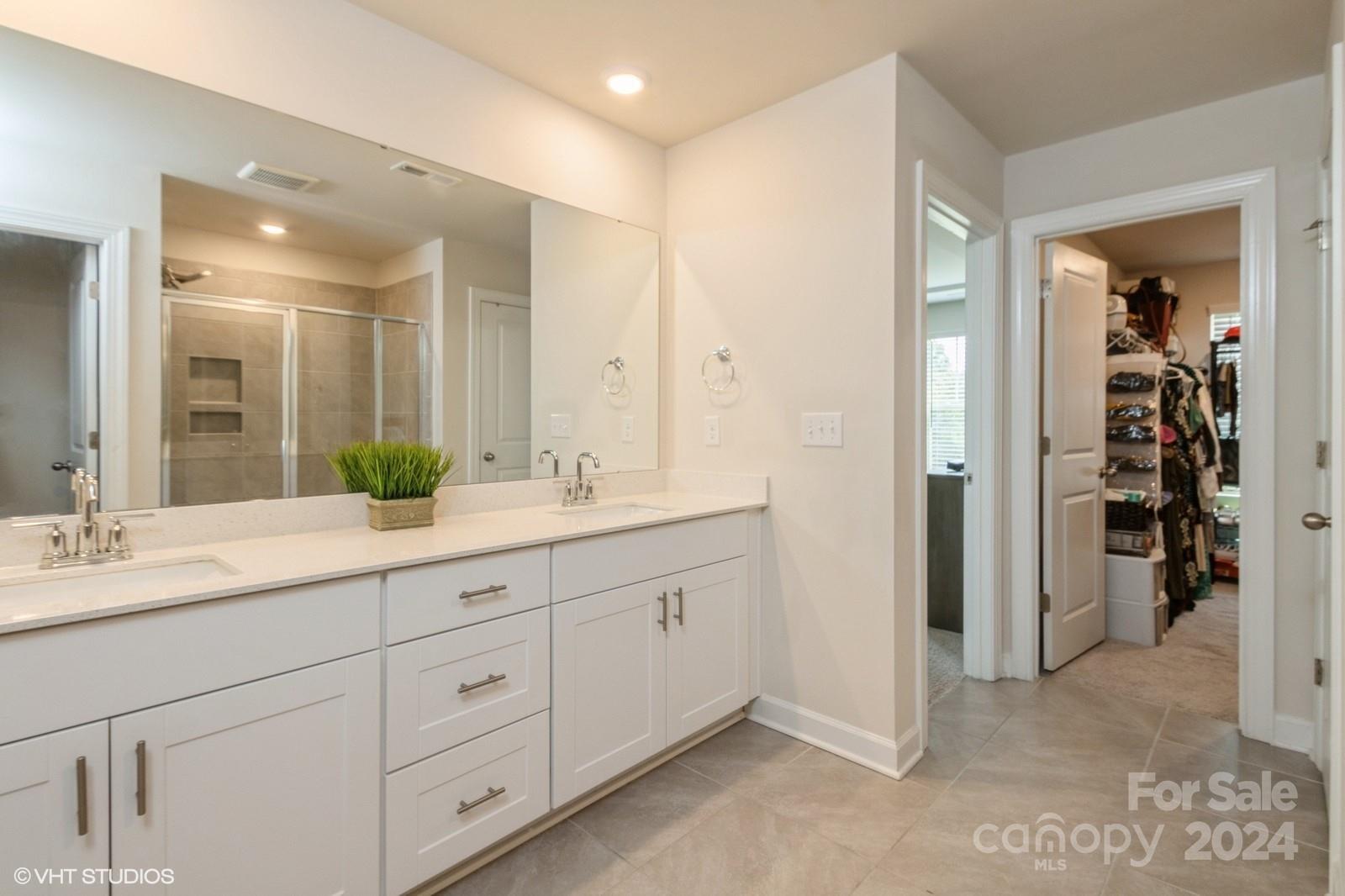 11955 Old Statesville Road Huntersville, NC 28078 - Photo 21 of 39 a bathroom with double sink and a mirror