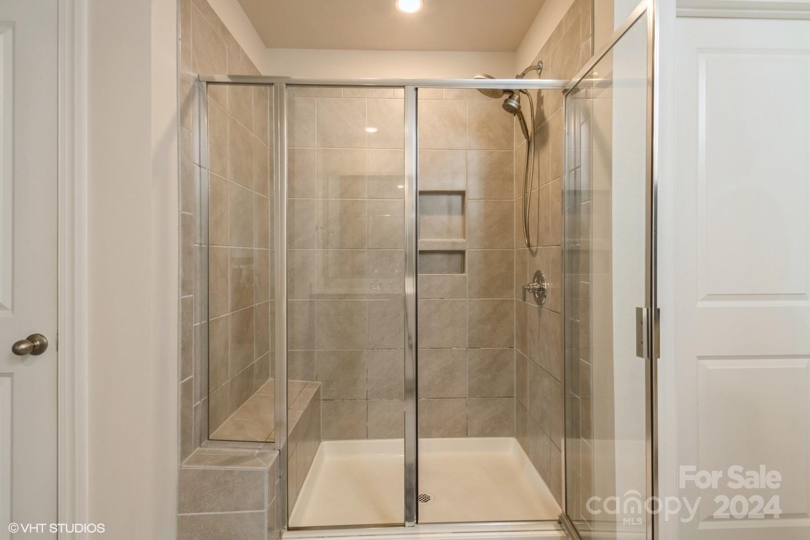 11955 Old Statesville Road Huntersville, NC 28078 - Photo 23 of 39 a bathroom with a shower and a glass door