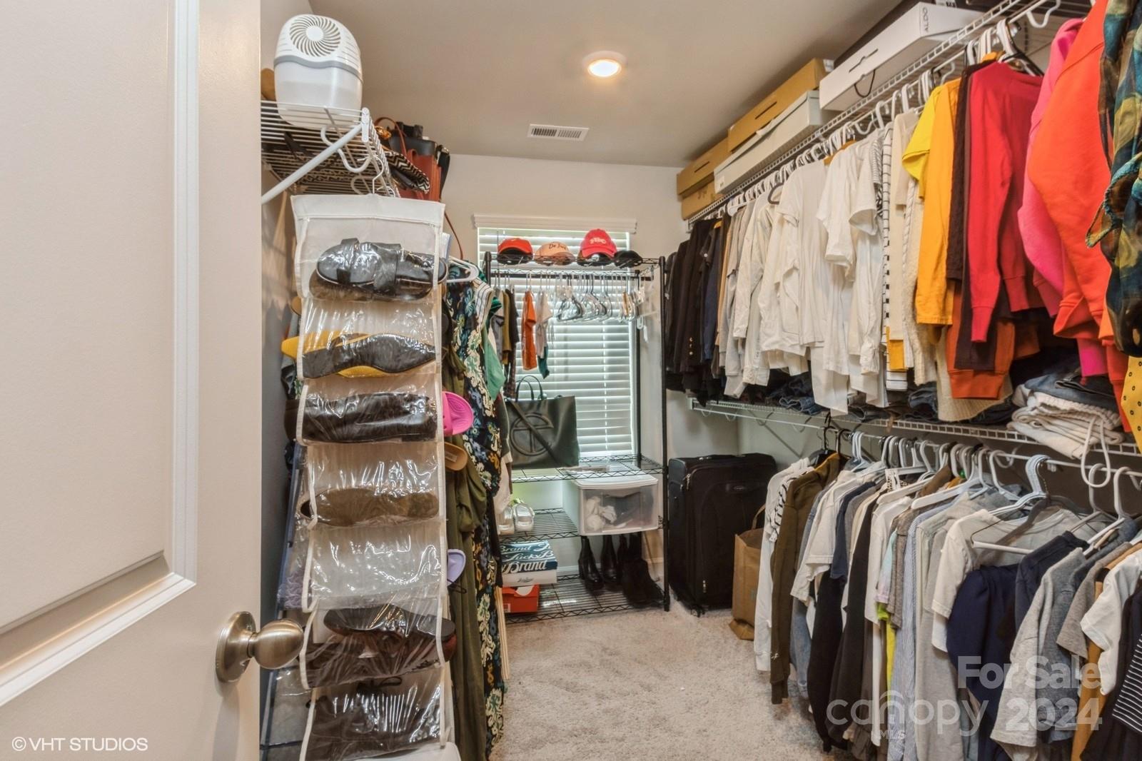 11955 Old Statesville Road Huntersville, NC 28078 - Photo 24 of 39 a view of walk in closet with clothes and shoes