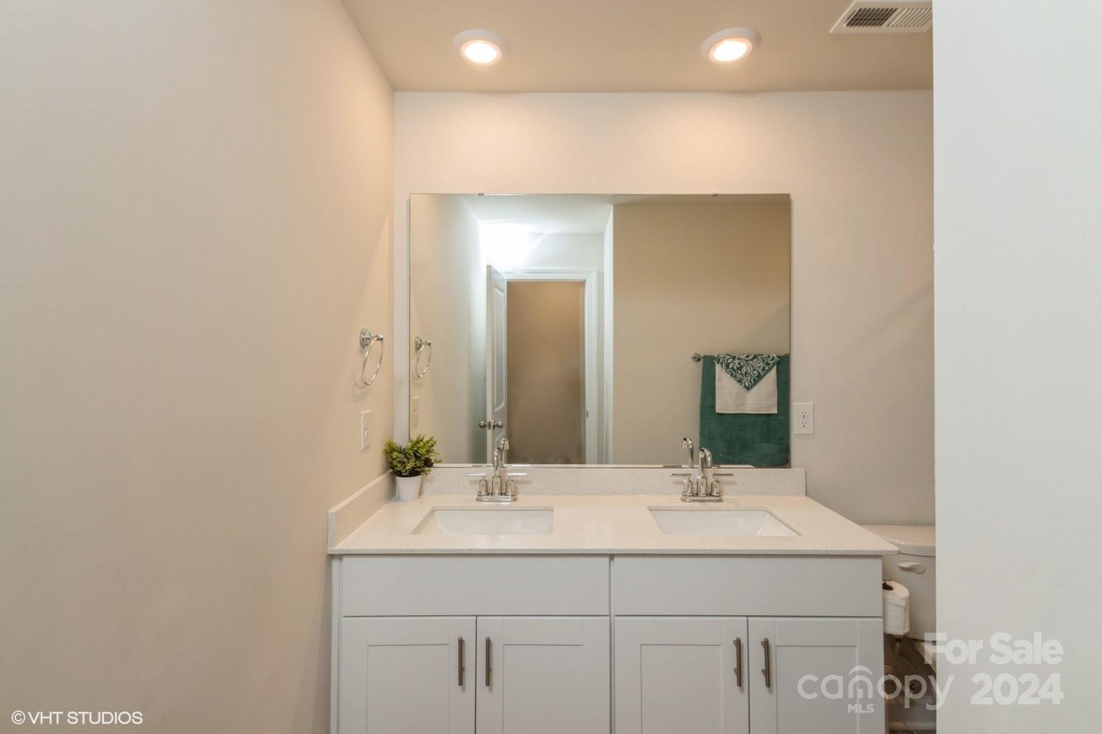 11955 Old Statesville Road Huntersville, NC 28078 - Photo 28 of 39 a bathroom with a sink and a mirror
