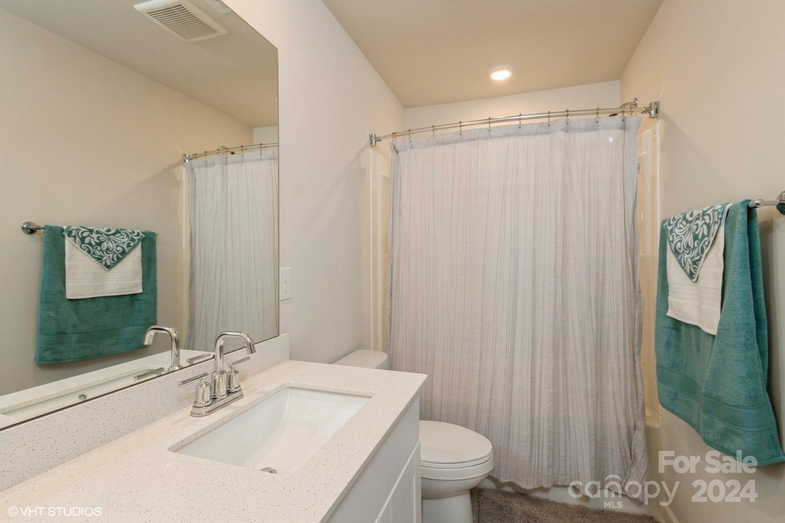 11955 Old Statesville Road Huntersville, NC 28078 - Photo 29 of 39 a bathroom with a sink toilet and shower