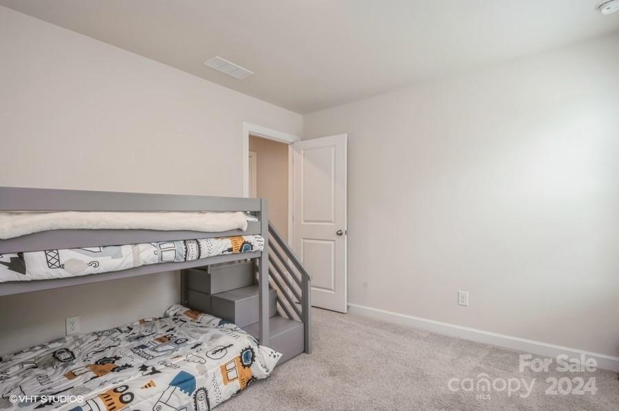 11955 Old Statesville Road Huntersville, NC 28078 - Photo 31 of 39 a bedroom with a bed and a window