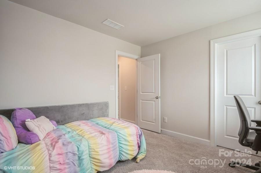 11955 Old Statesville Road Huntersville, NC 28078 - Photo 32 of 39 a bedroom with a bed and a window