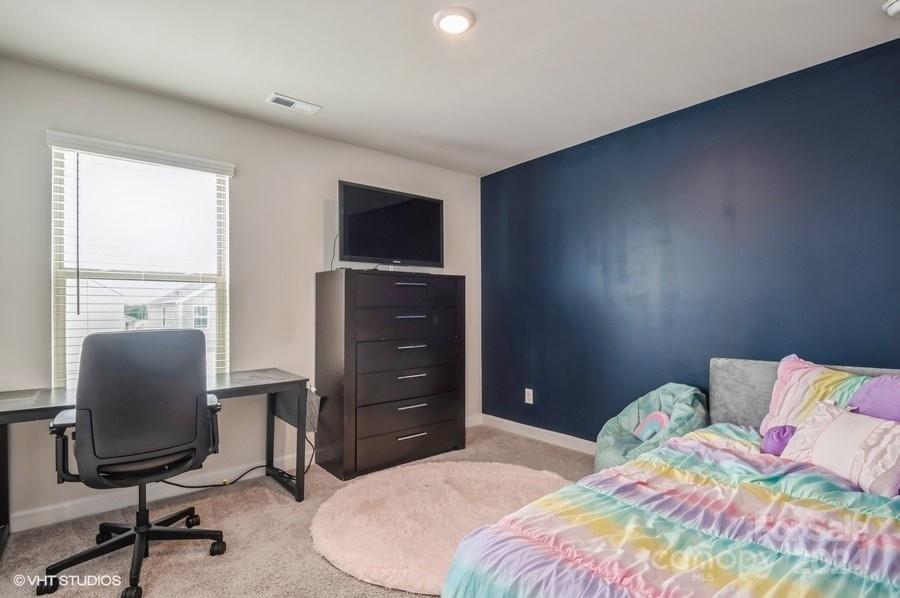 11955 Old Statesville Road Huntersville, NC 28078 - Photo 33 of 39 a bedroom with a bed and a desk