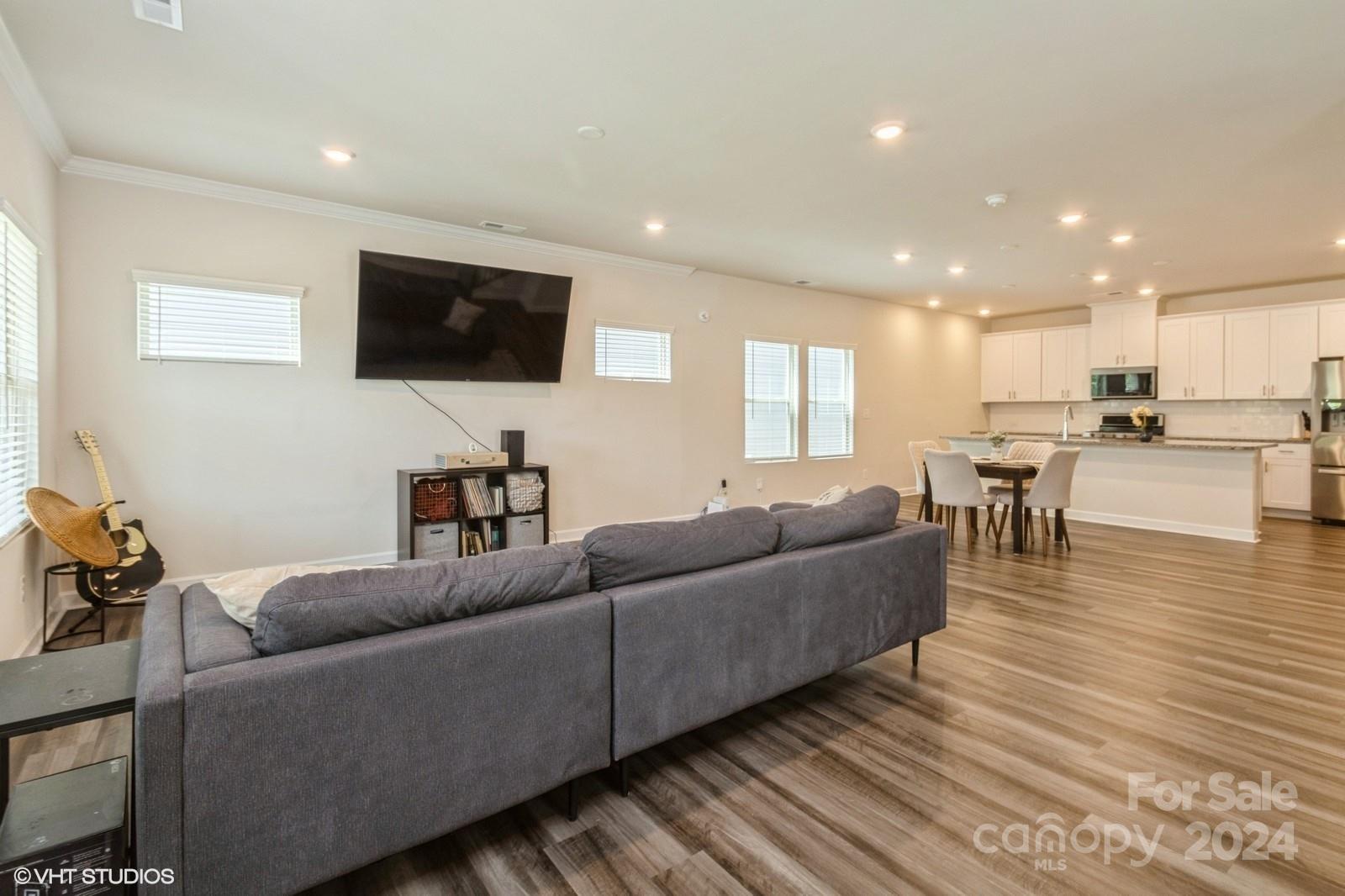 11955 Old Statesville Road Huntersville, NC 28078 - Photo 6 of 39 a living room with furniture and a flat screen tv