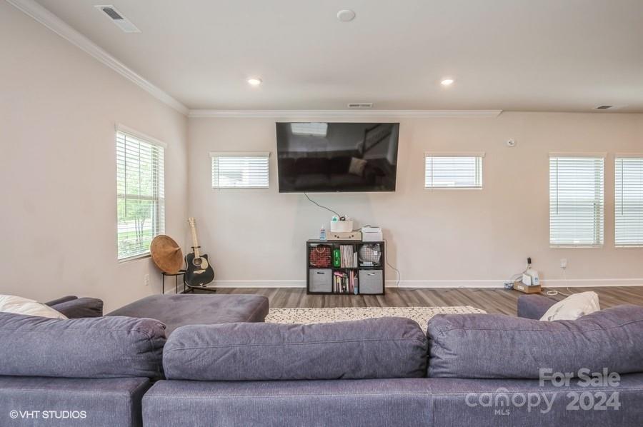 11955 Old Statesville Road Huntersville, NC 28078 - Photo 7 of 39 a living room with furniture and a flat screen tv