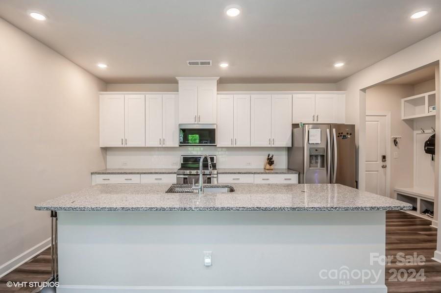 11955 Old Statesville Road Huntersville, NC 28078 - Photo 10 of 39 a kitchen with stainless steel appliances granite countertop a sink refrigerator and cabinets