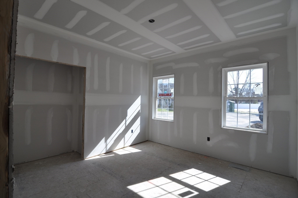 1 Depot Street, Unit 1 Townsend, MA 01469 - Photo 14 of 26 an empty room with windows