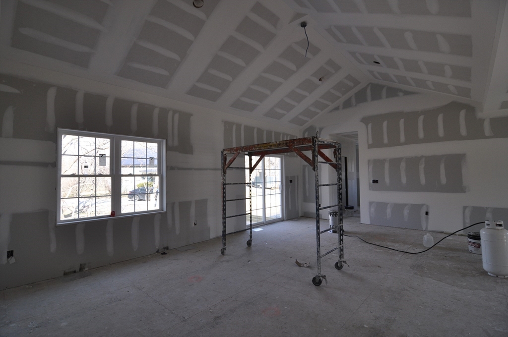 1 Depot Street, Unit 1 Townsend, MA 01469 - Photo 18 of 26 an empty room with windows