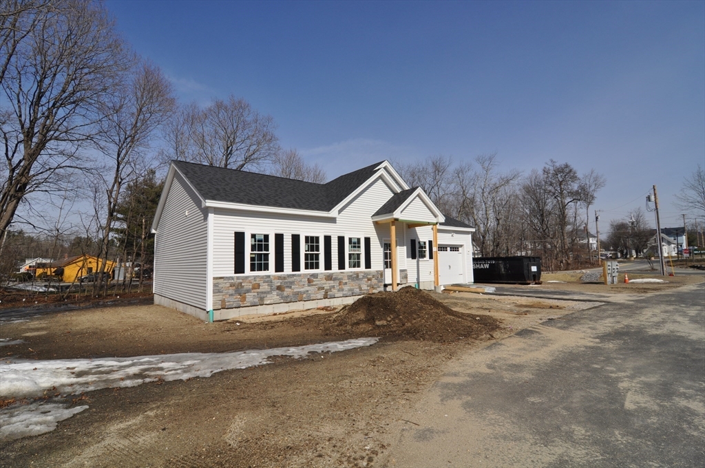 1 Depot Street, Unit 1 Townsend, MA 01469 - Photo 19 of 26 a front view of a house with a yard